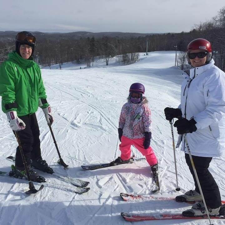 John Chafe skiing with his family