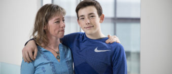 Spencer Ottens stands with his mother, Ellen Ottens