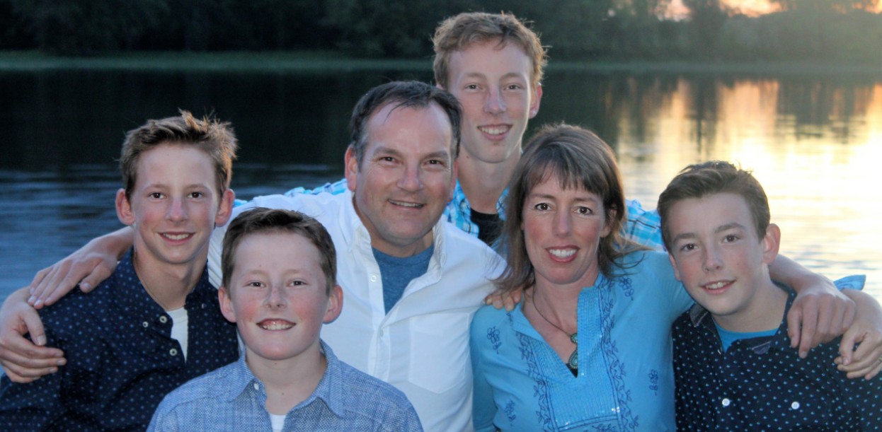 Spencer Ottens smiling with his family