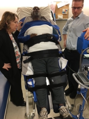 Fran is secured to an adjustable bed prior to using the CAREN machine at the Ottawa Hospital Rehab Centre.