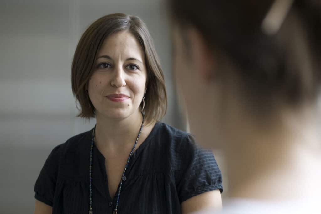 Heather McKenna, a social worker at The Ottawa Hospital, talking with a patient