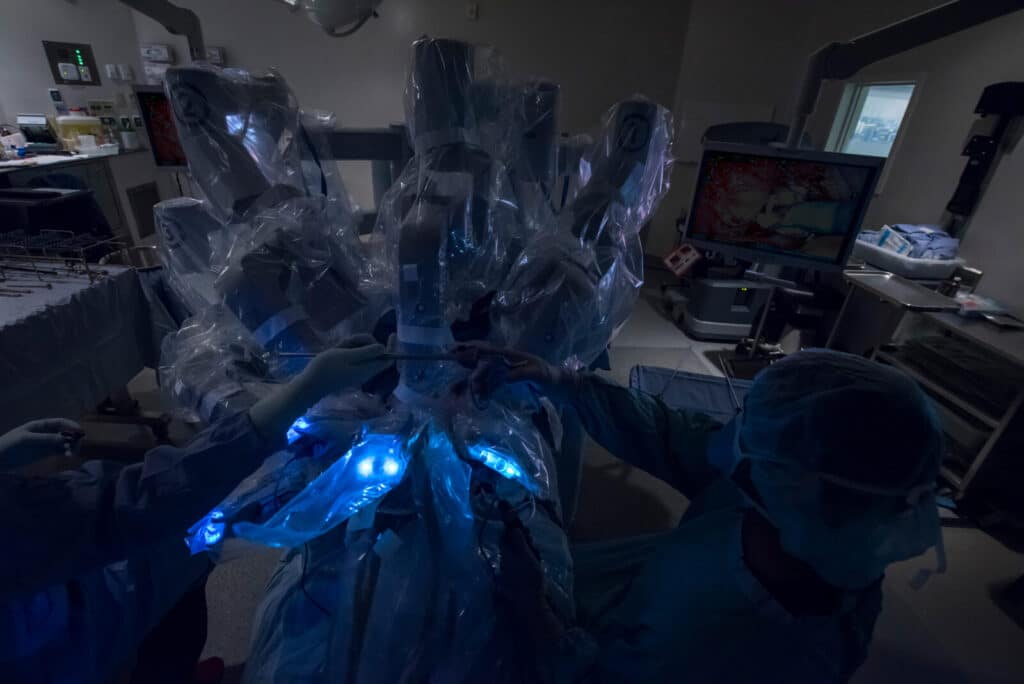 Surgical team operating the da Vinci robotic surgical system
